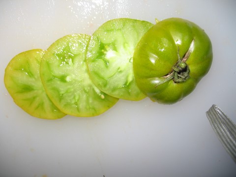 Sliced Dorothy's Green, Heirloom Tomato.  Firm, juicy, slightly sweet.