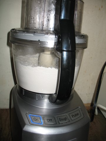 Cuisinart 14 cup food processor with 3 cups of flour.